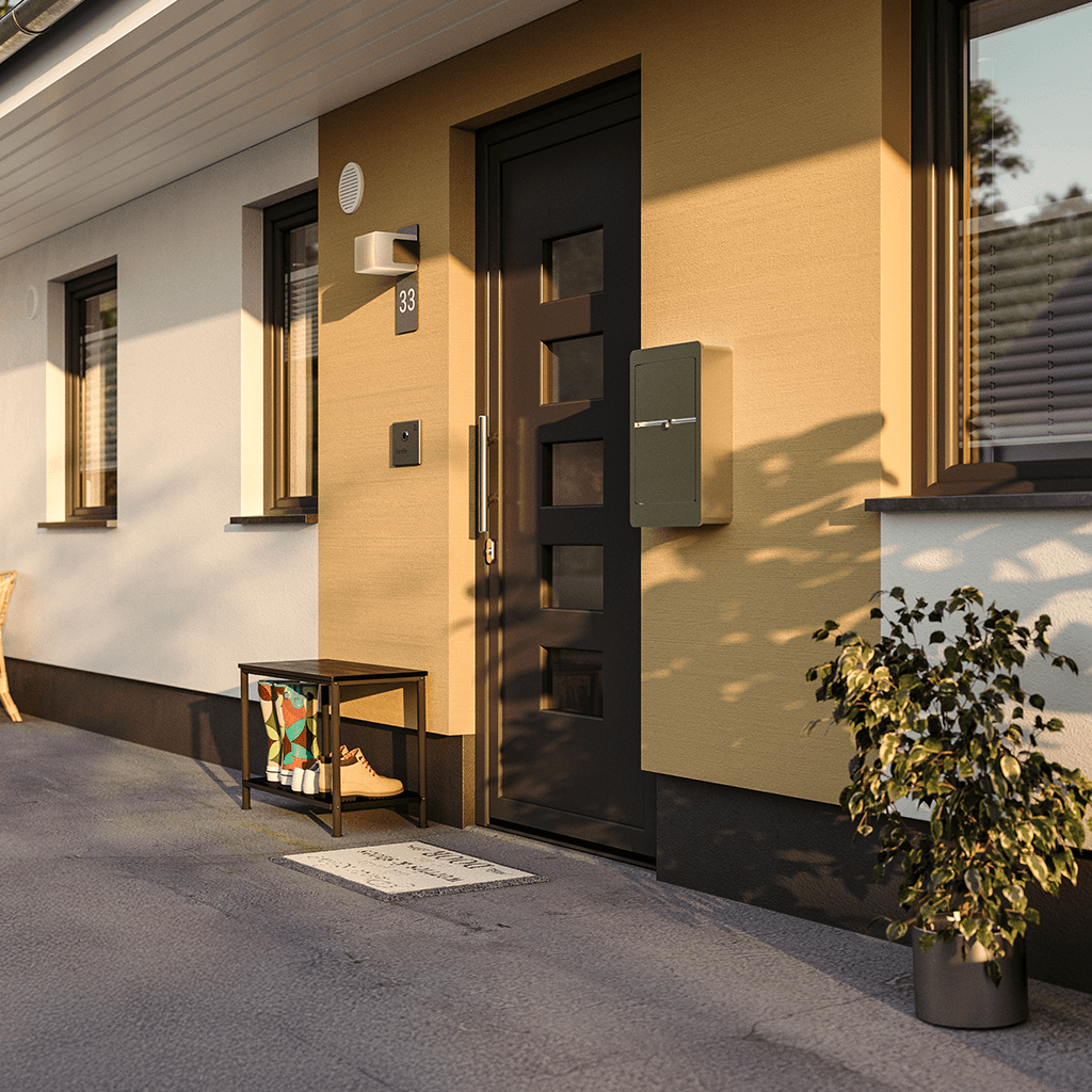 Moderner Eingangsbereich eines Einfamilienhauses mit heller Fassade und Holzakzenten. Beispiel für zeitgemäße Architektur bei Vionda Haus.